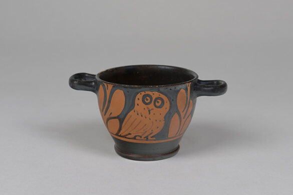 A small drinking cup from about 400 B.C. that features a simple drawing of an owl.