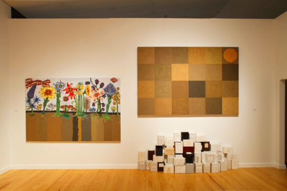 A photograph of two artworks by Wayne Gilbert installed on a gallery wall.